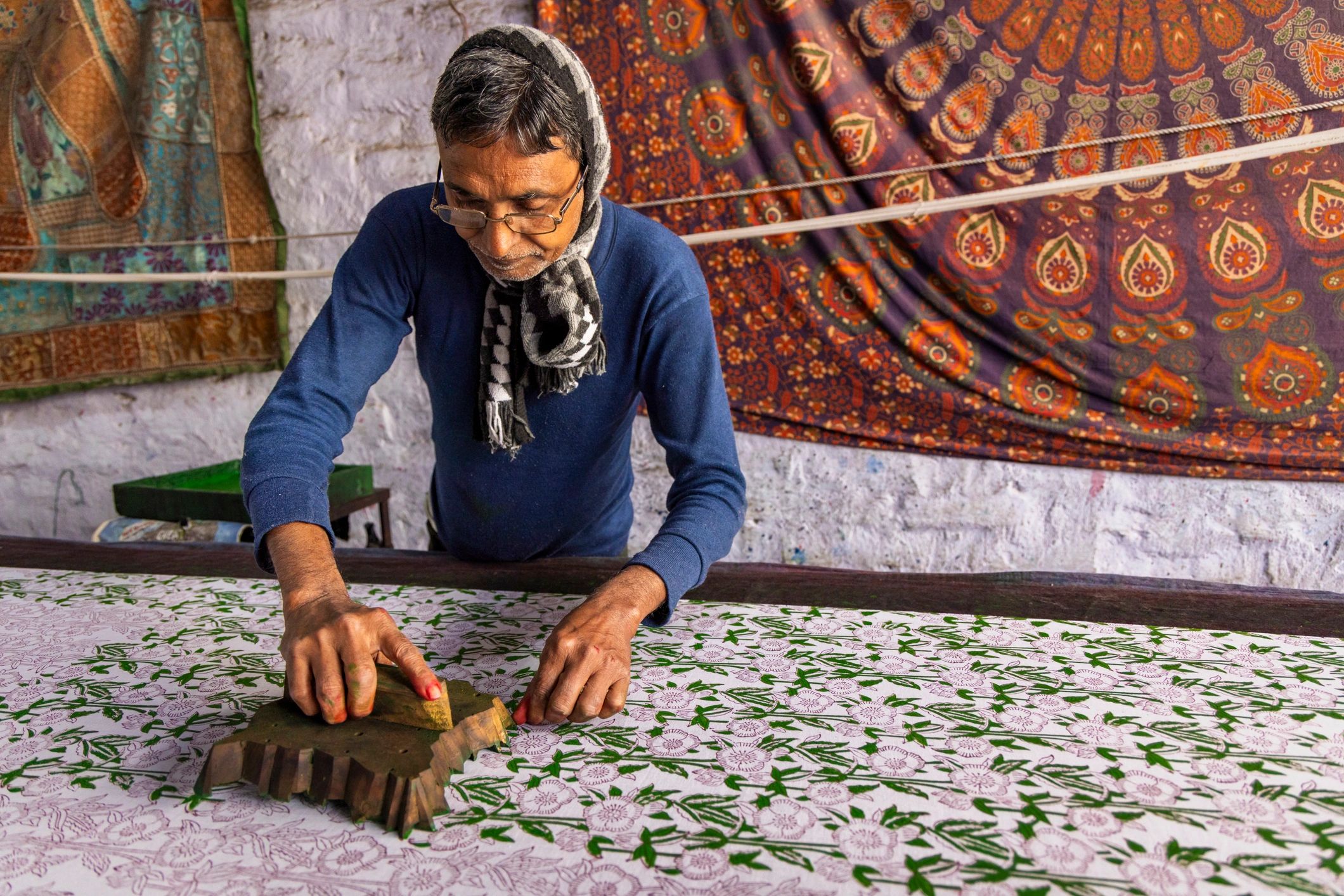 Portrait of a craftsman at work in a textile workshop